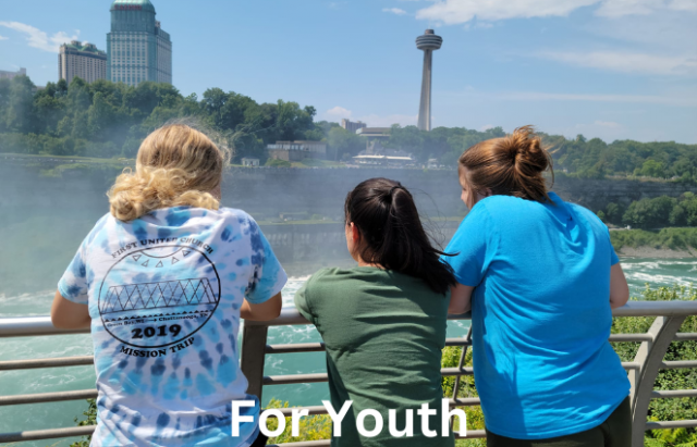 Image of 3 teenagers on a youth group mission trip.