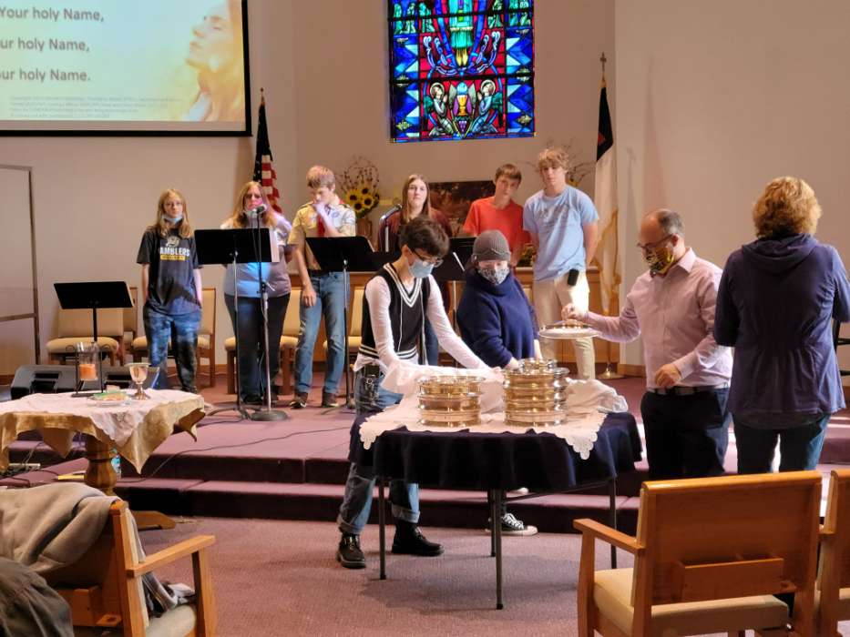 Youth group serving communion